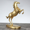Gold copper horse statue rearing up angle view