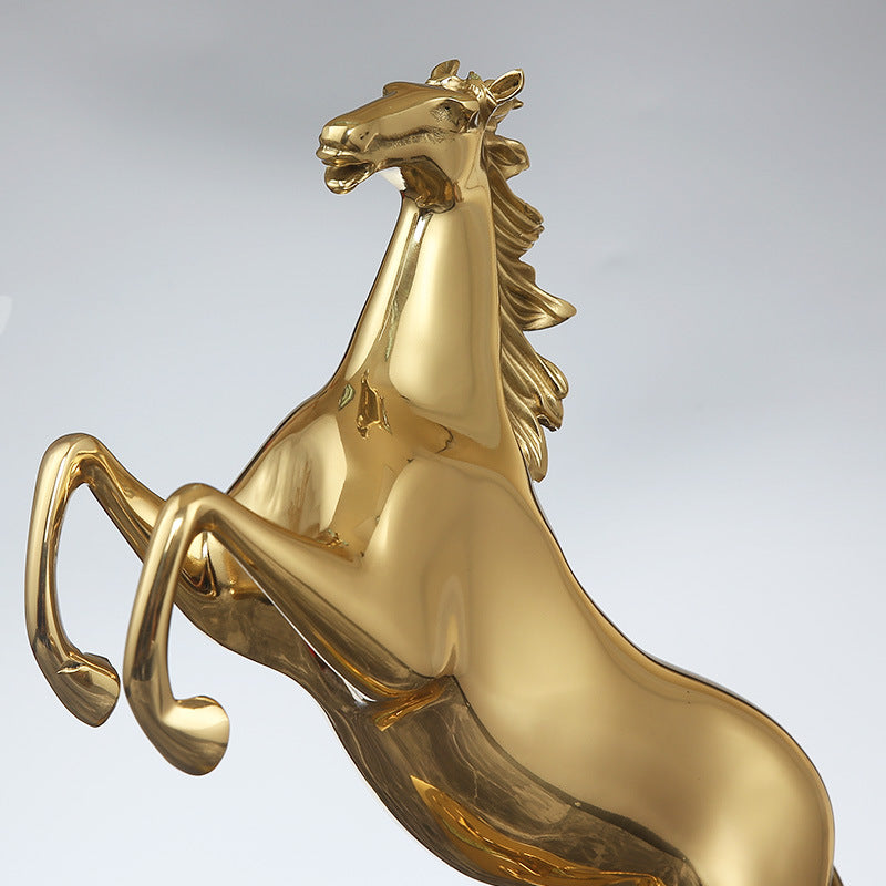 Close up detail of gold horse sculpture head