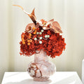 Polished Marble Bulbous Vase styled with red and orange florals