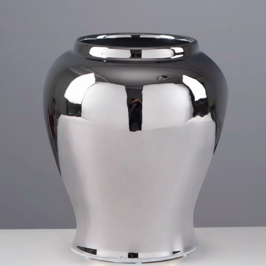 Close up of polished silver finish urn vase isolated