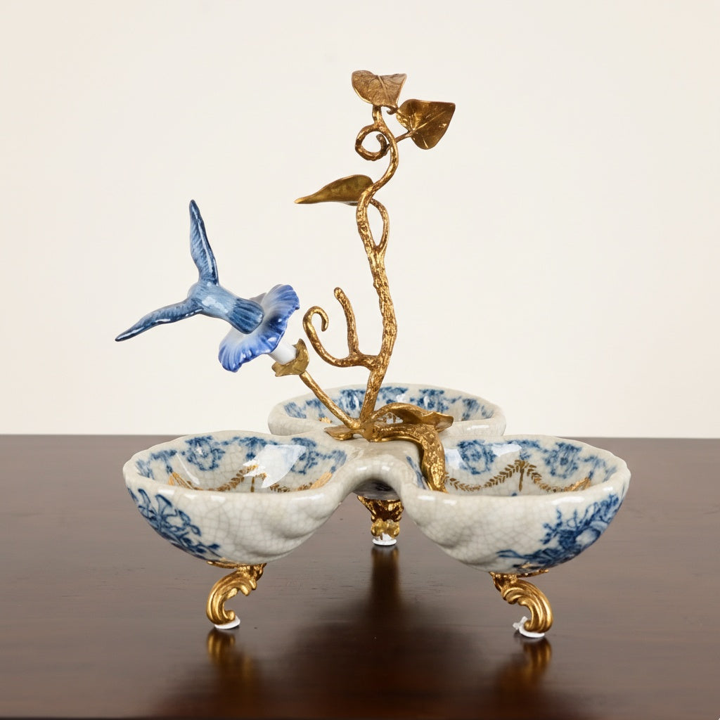 Back view of blue and white porcelain serving dish with gold vine detail