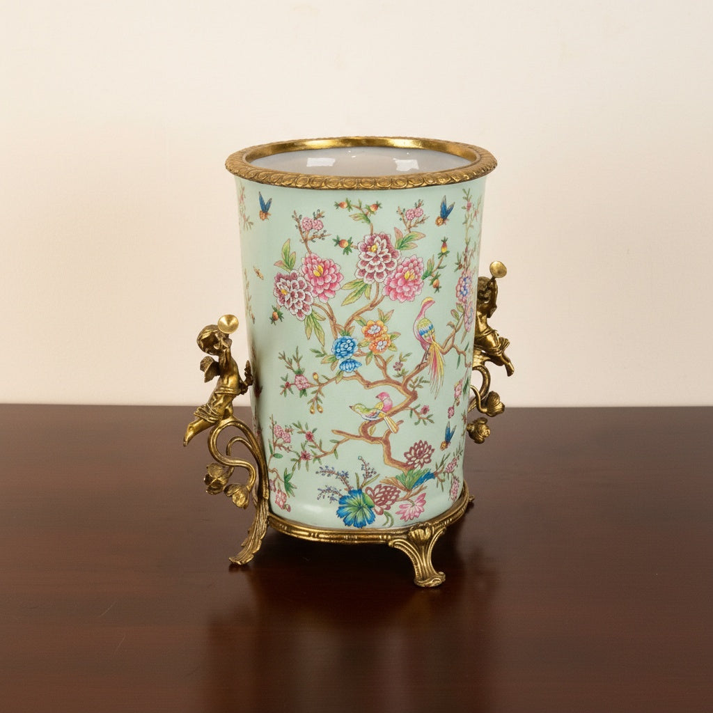 Porcelain and brass chinoiserie jardiniere angled view on dark table