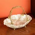 Angled view of empty porcelain basket with brass handle