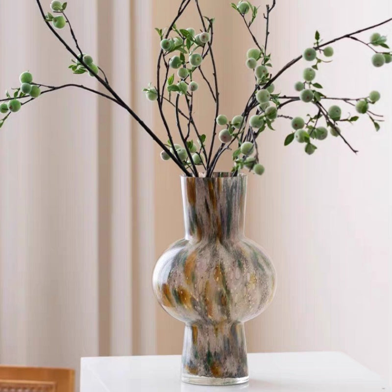 Multicolored glass bulbous vase with green branches