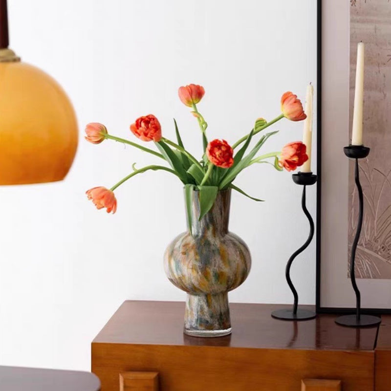 Lifestyle shot of multicolored glass vase with tulips