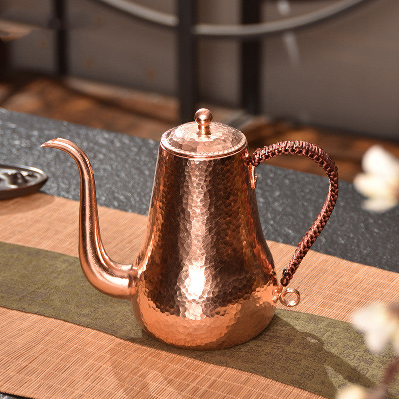 Hammered finish copper tea kettle side view