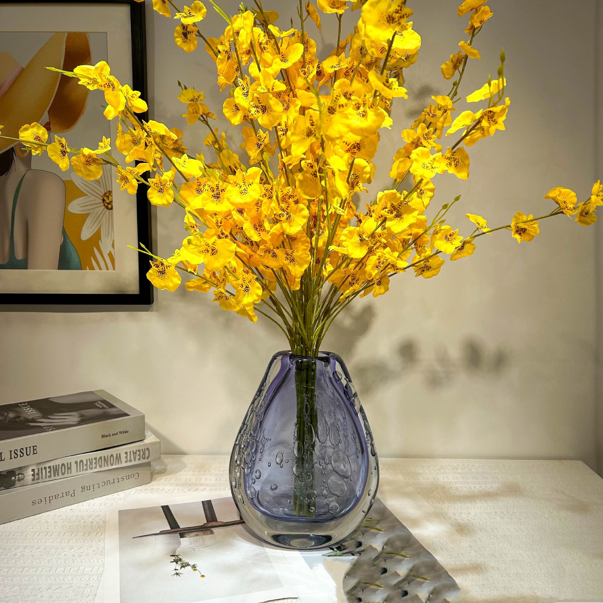 Purple bubble glass vase with yellow flowers