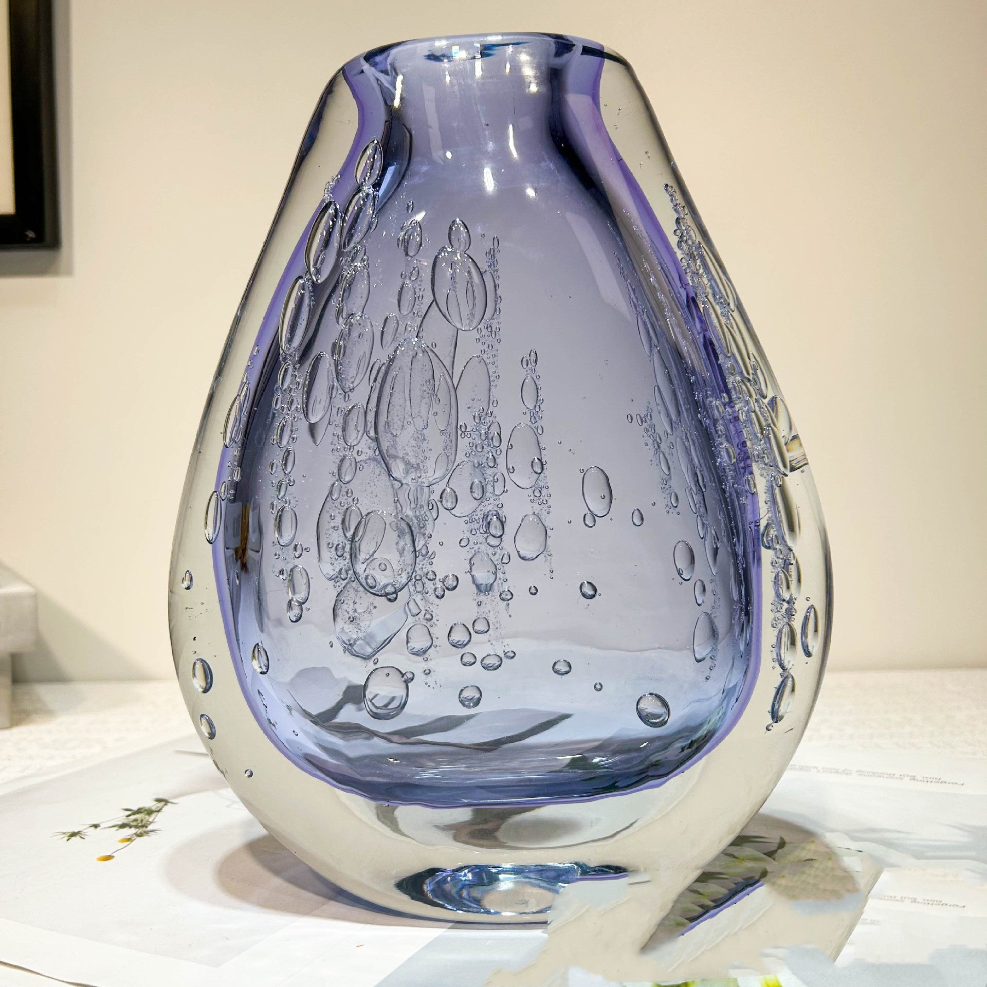 Front view of empty purple teardrop vase
