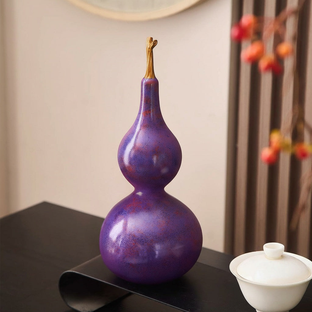 Angled view of glossy purple resin decorative gourd