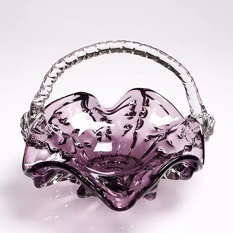 Empty purple art glass basket with ruffled edges