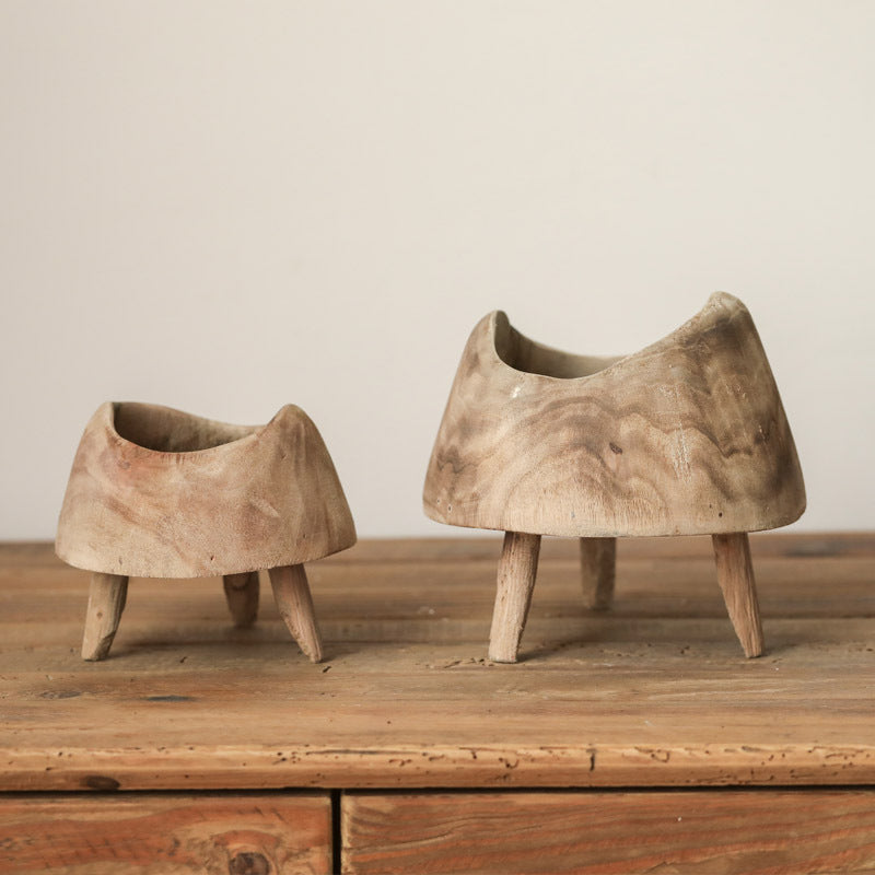 Studio shot comparison of small and large raw wood tripod bowls against a neutral background