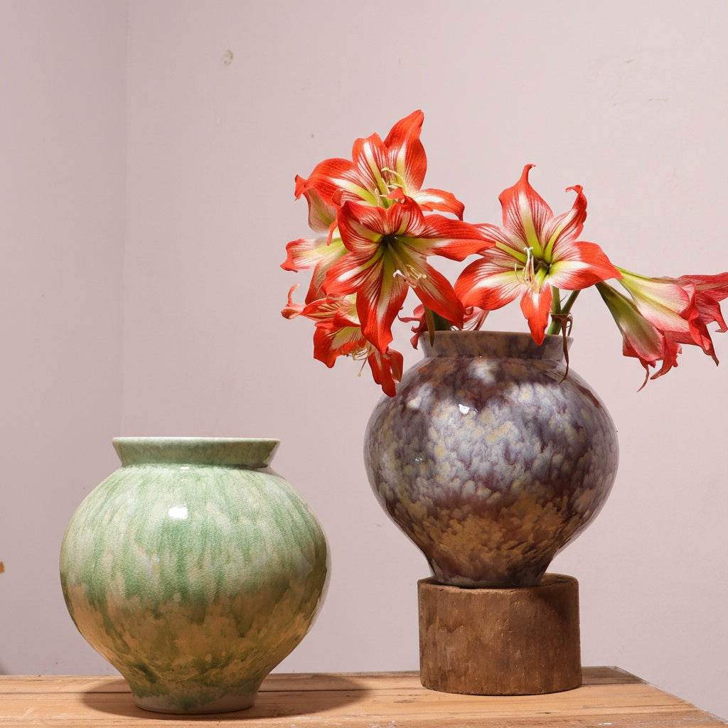 Green and purple ceramic vases with reactive glaze finish