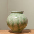 Green reactive glaze ceramic round vase front view