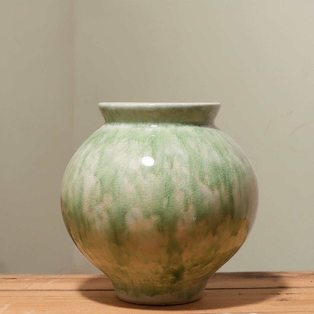 Green reactive glaze ceramic round vase front view