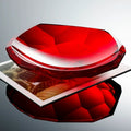 Red crystal glass faceted centerpiece bowl styled on a coffee table for luxury modern home decor