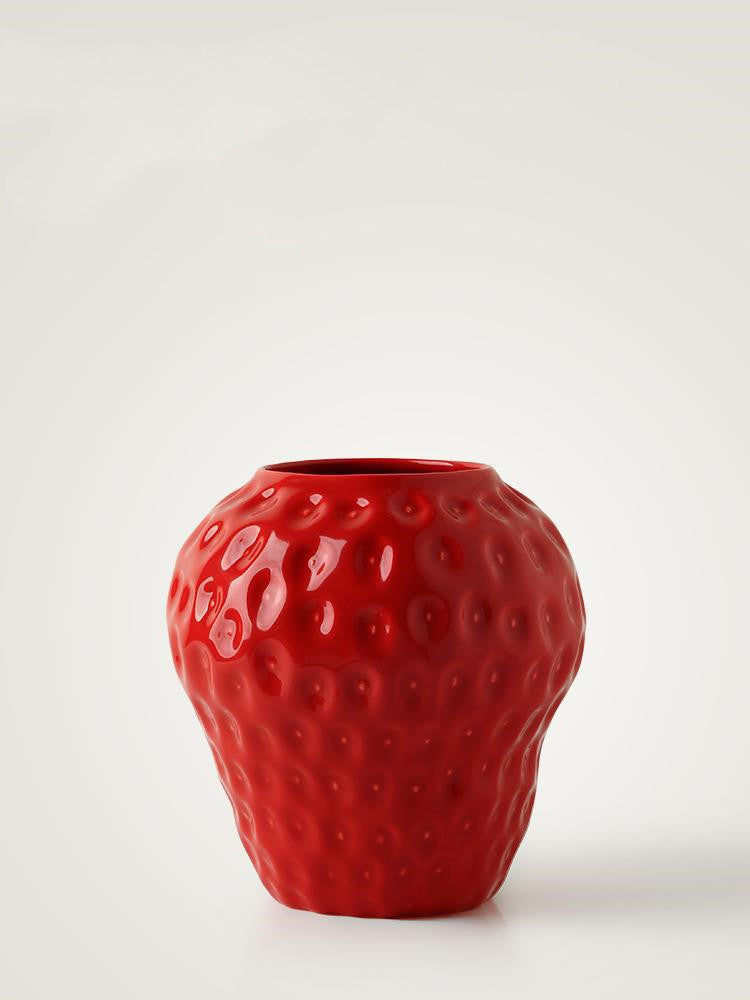 Isolated view of red ceramic strawberry vase