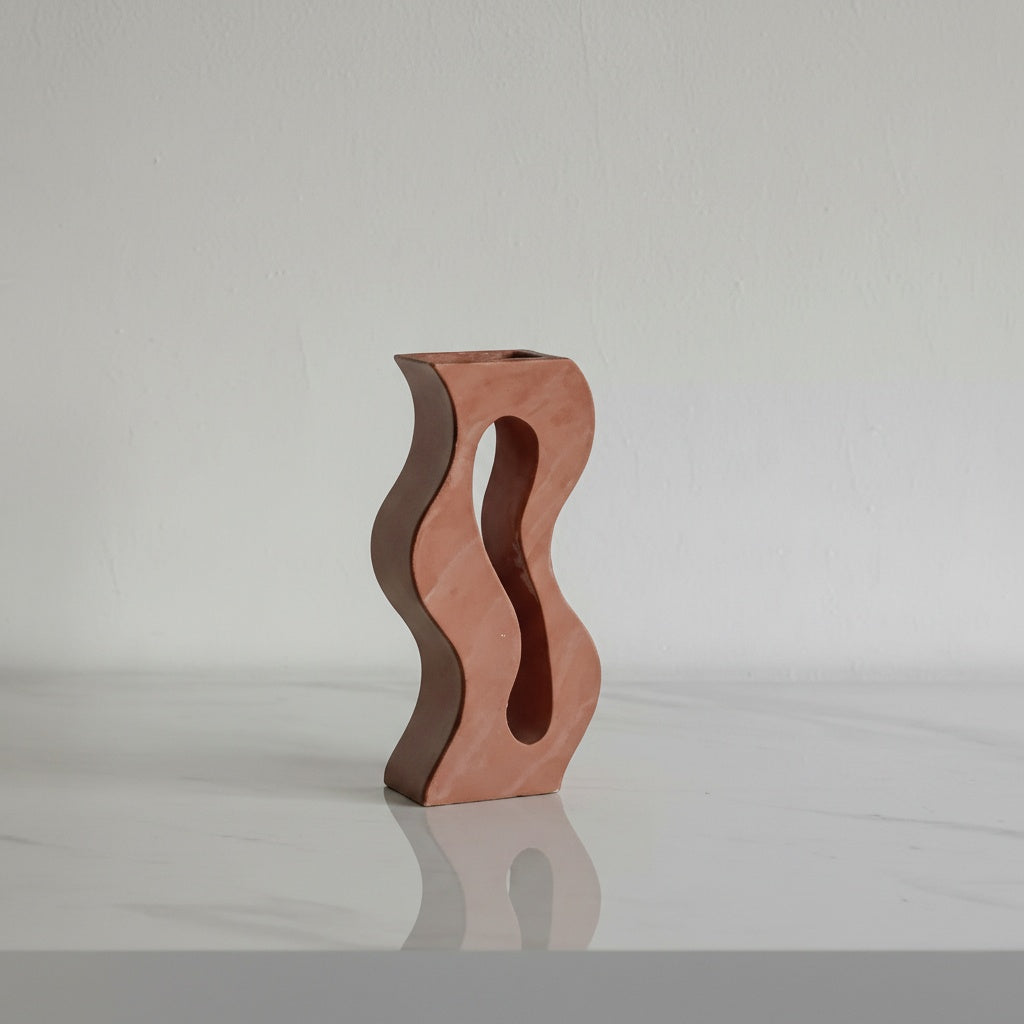 Red sandstone finish wavy cutout vase studio shot