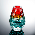 Front view of red and teal faceted glass vase