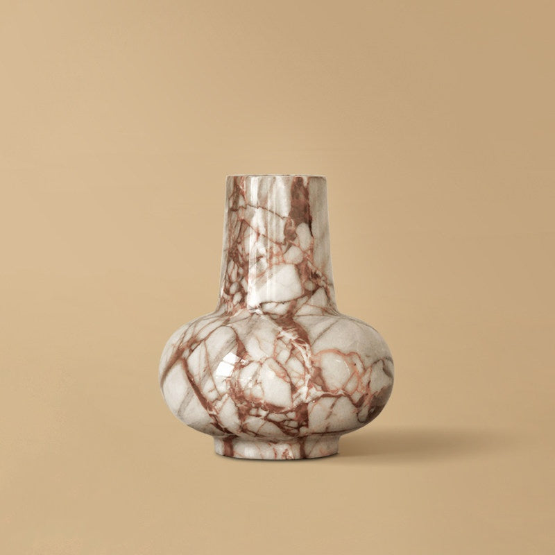 Front view of red veined marble vase on plain background
