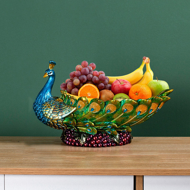 Side view of peacock fruit bowl holding fruit