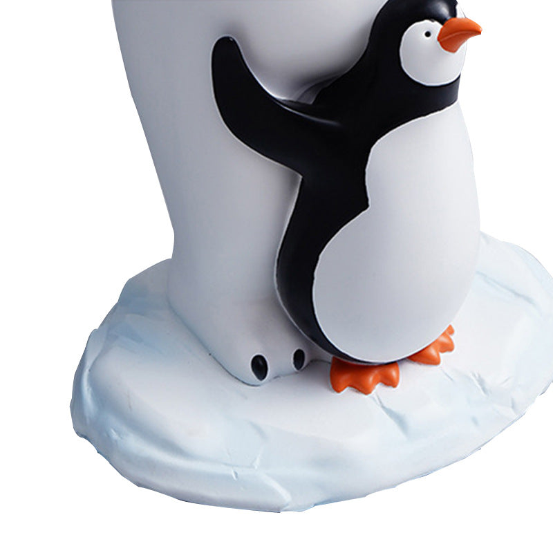 Close up detail of penguin hugging polar bear legs