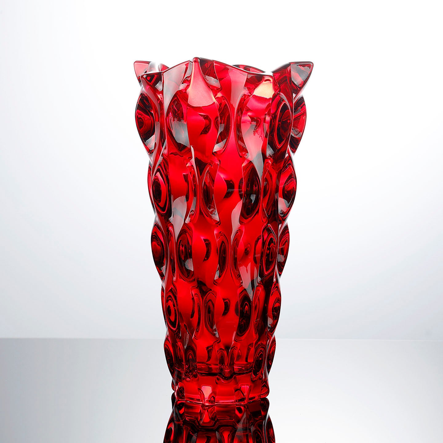 Ruby red crystal vase with geometric dimpled texture
