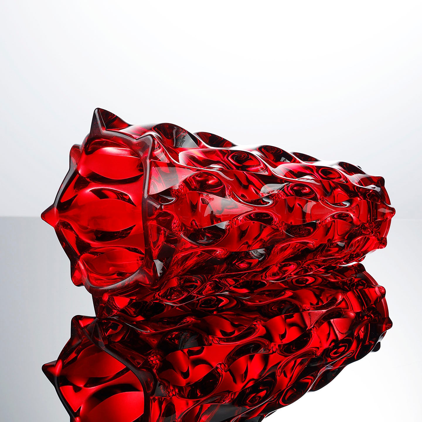 Top down view showing angular rim of red crystal vase
