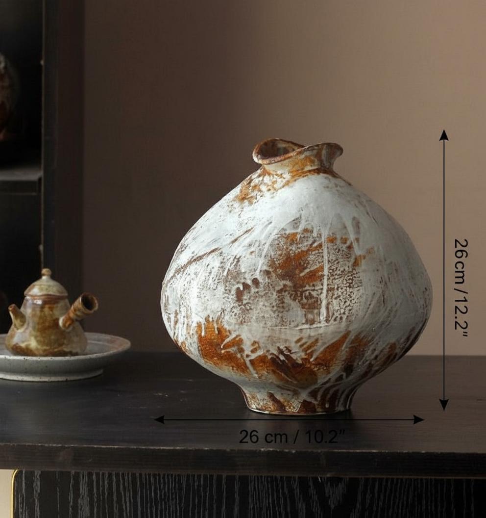 Set of two rustic ceramic vases on dark table