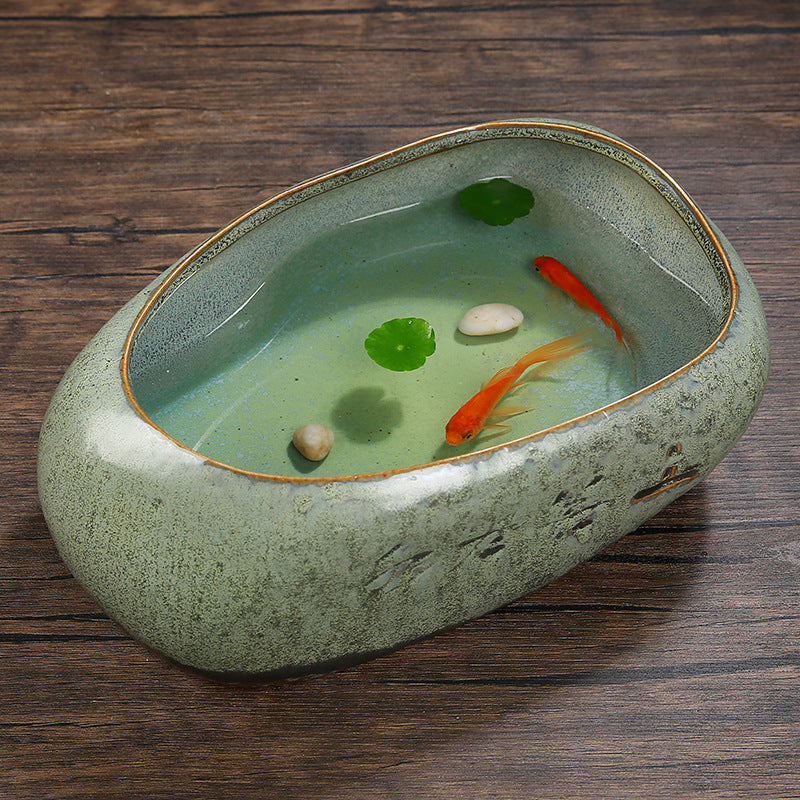 Ceramic oval water vessel with goldfish
