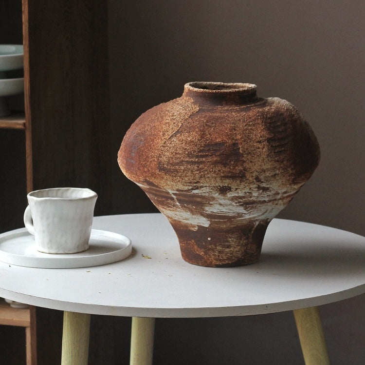 Medium squat ceramic vessel in earthy brown tones
