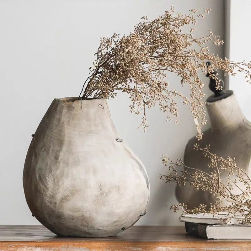 Short organic wood vase with dried flowers