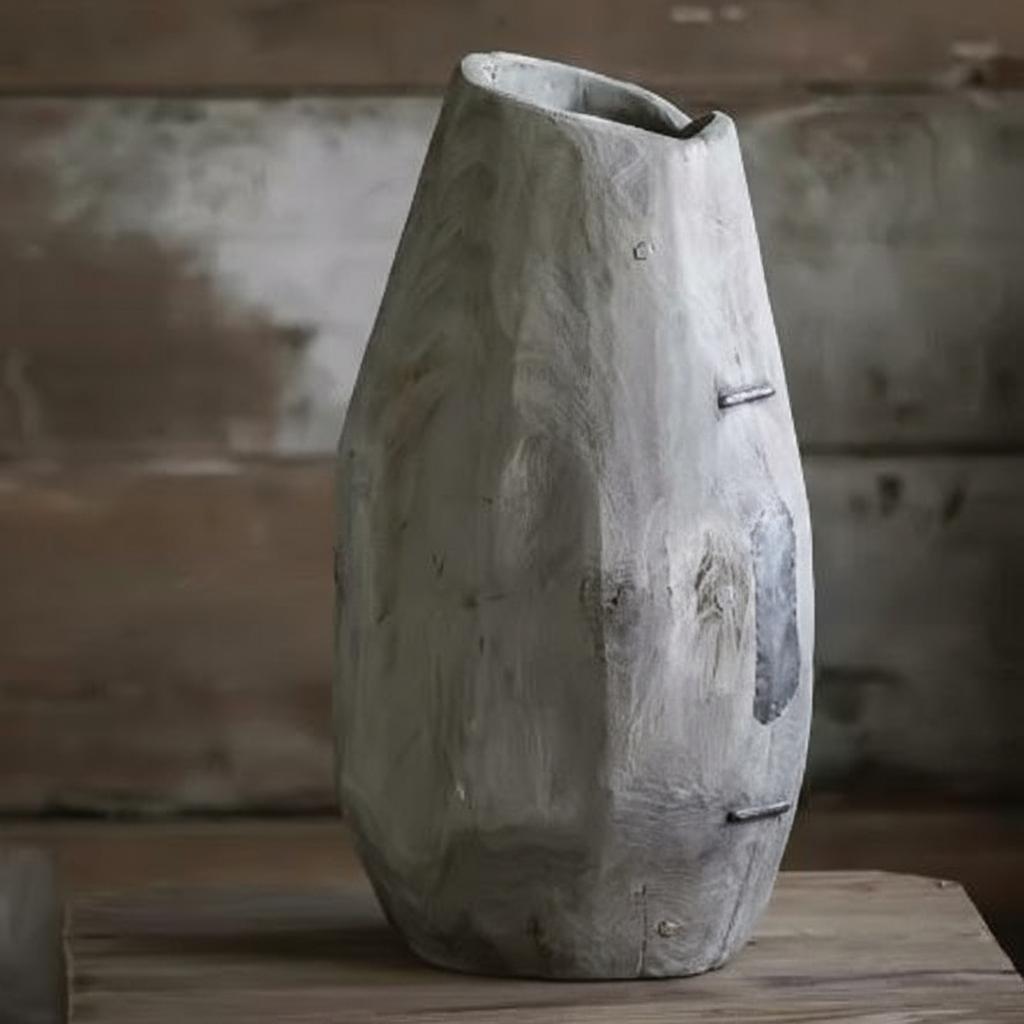 Tall hand carved wooden vase side view