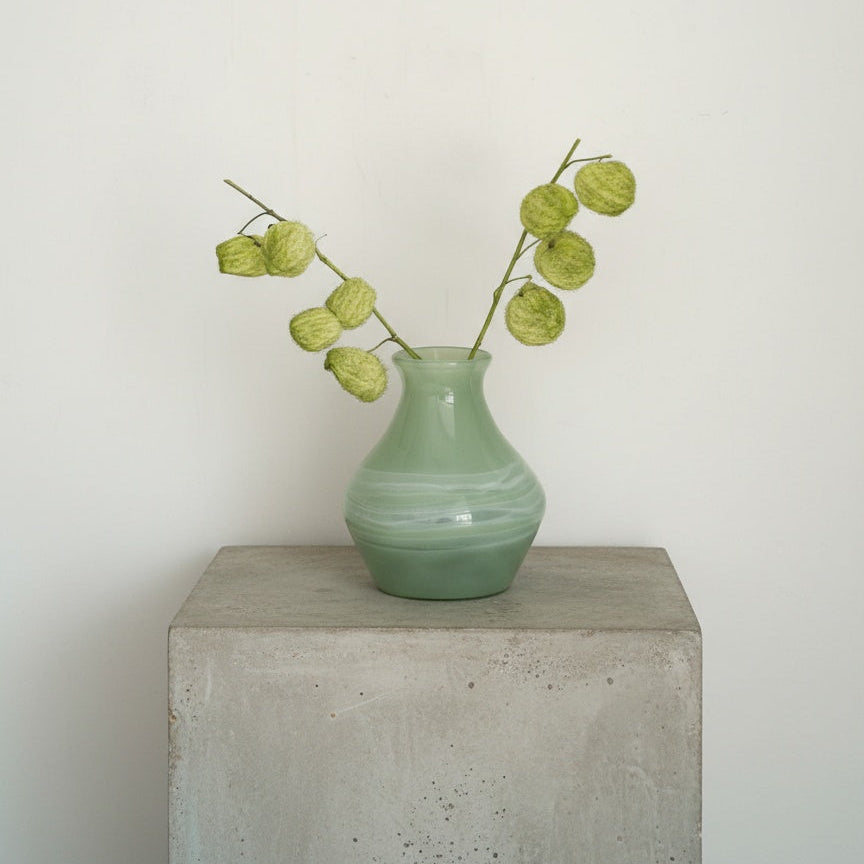 Medium stout sage green swirled glass vase with green pom pom branches