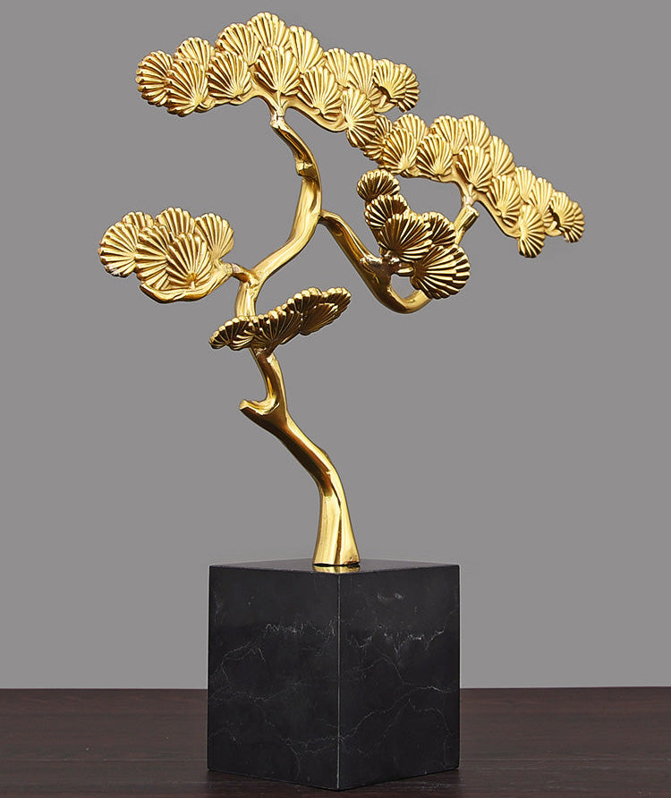 Angled view of gold brass bonsai statue showing detailed branch structure