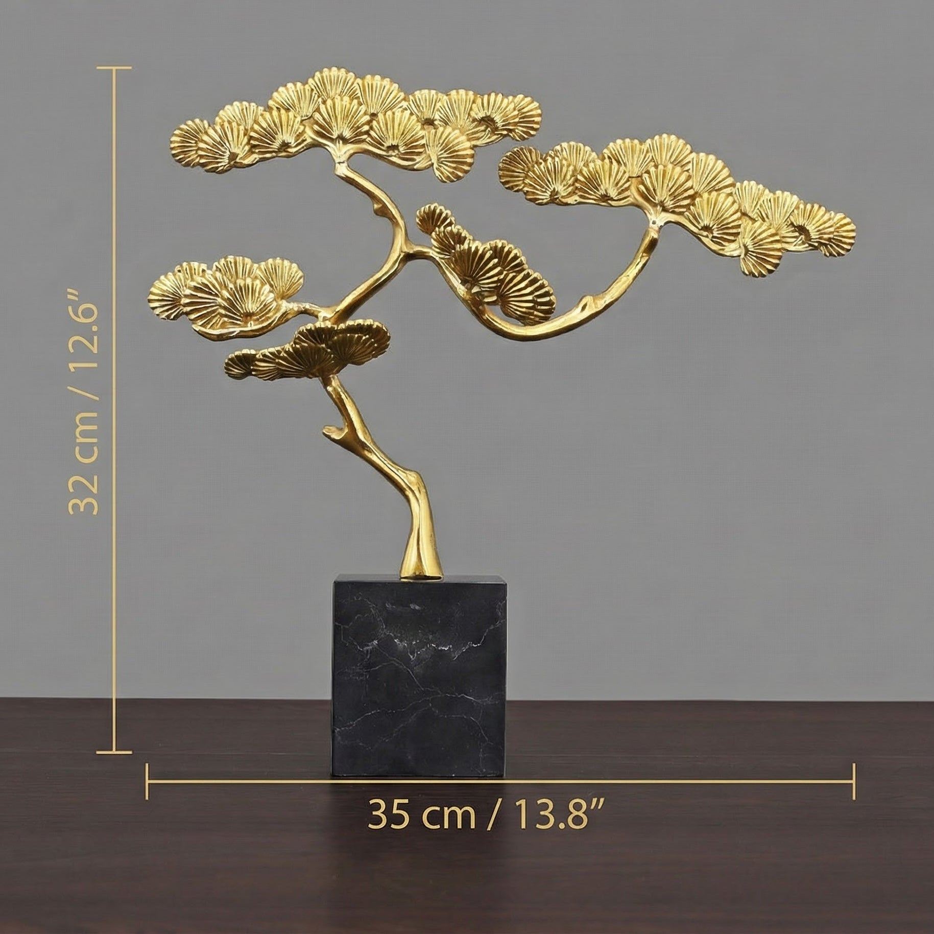 Dimension guide for brass pine sculpture showing 32cm height and 35cm width