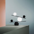 Black marble base table lamp with balancing white and black spheres