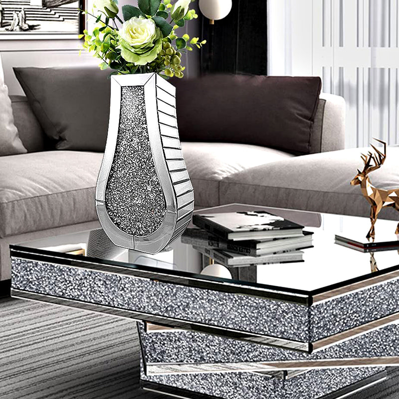 Detailed view of crushed diamond vase on mirrored coffee table
