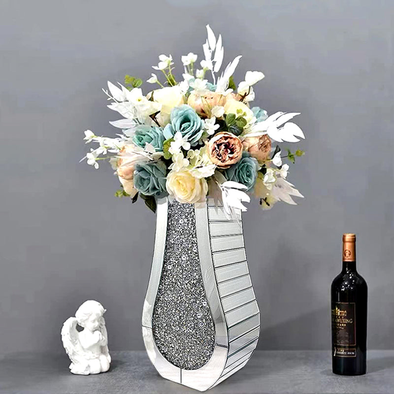 Full view of silver teardrop vase with floral arrangement