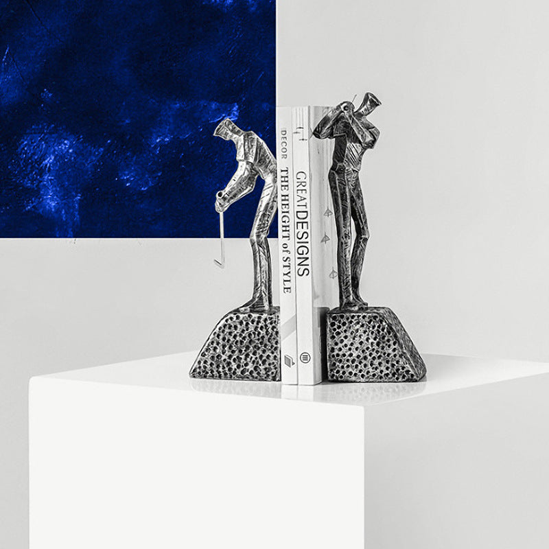 Silver resin golfer bookends holding books on shelf
