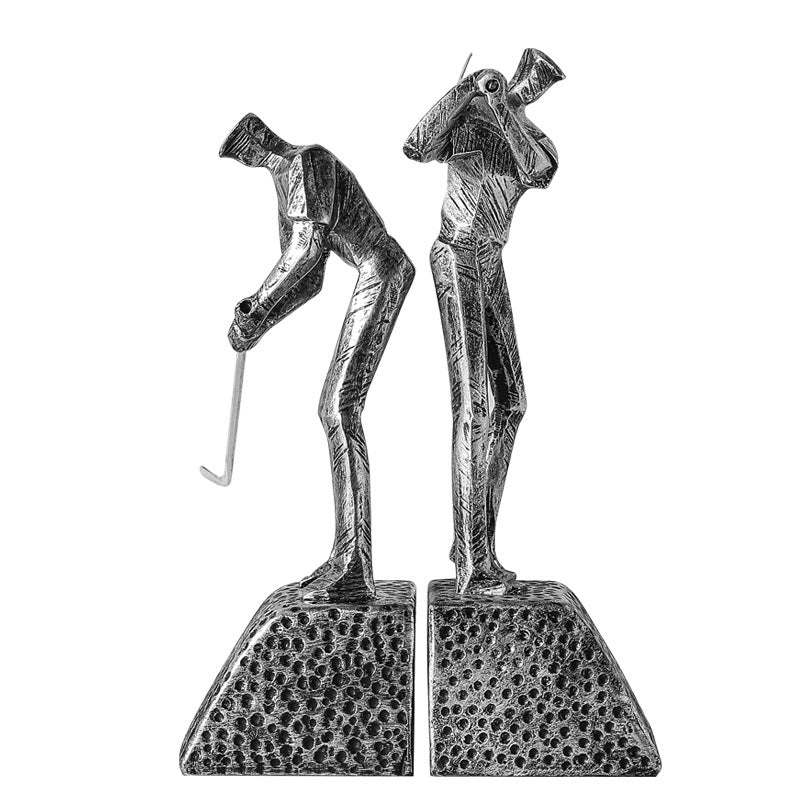 Pair of antique silver abstract golfer sculptures