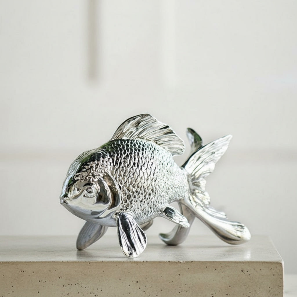 Detailed close up of textured scales on silver fish statue