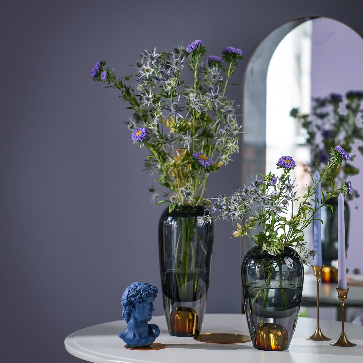 Luxury glass vase duo styled in front of mirror