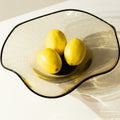 Overhead view of smoke seeded glass bowl with lemons