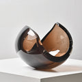 Front view of smoked amber glass sculptural centerpiece
