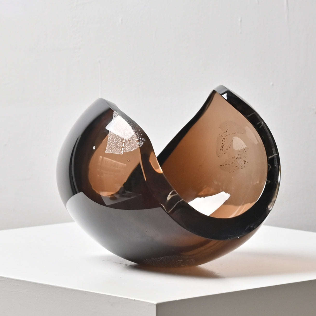 Front view of smoked amber glass sculptural centerpiece