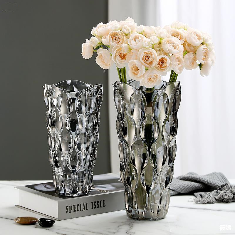 Smoked glass faceted flower vases with floral arrangement