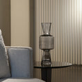 Smoked Glass Geometric Vase Next to Sofa