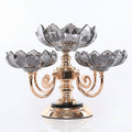 Front view of smoked glass and gold metal fruit bowl centerpiece