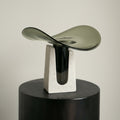 Smoked glass and travertine sculptural vase front view