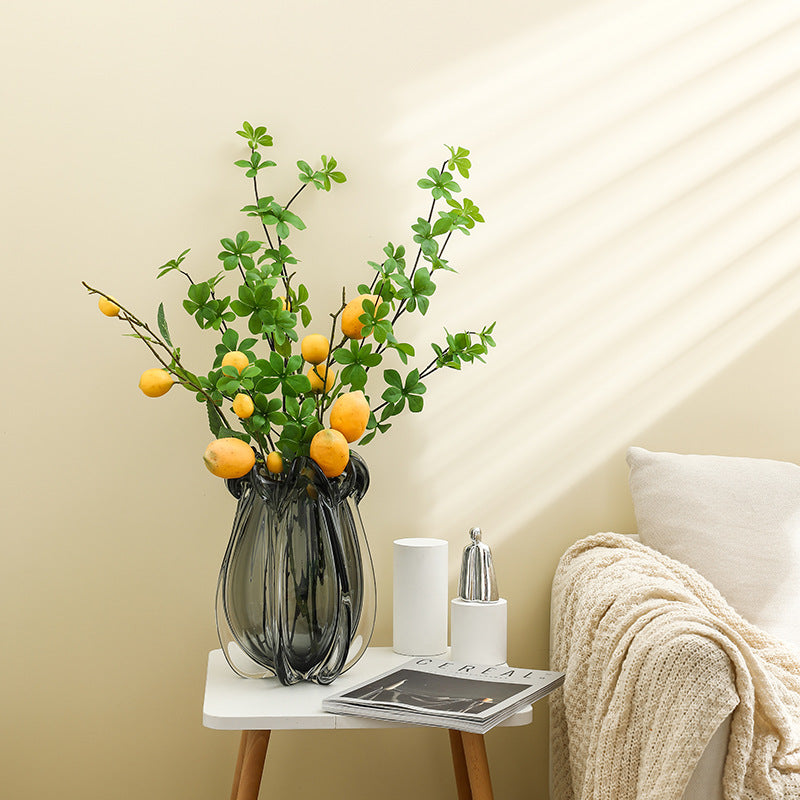 Smoked grey glass fluted vase with lemon branches